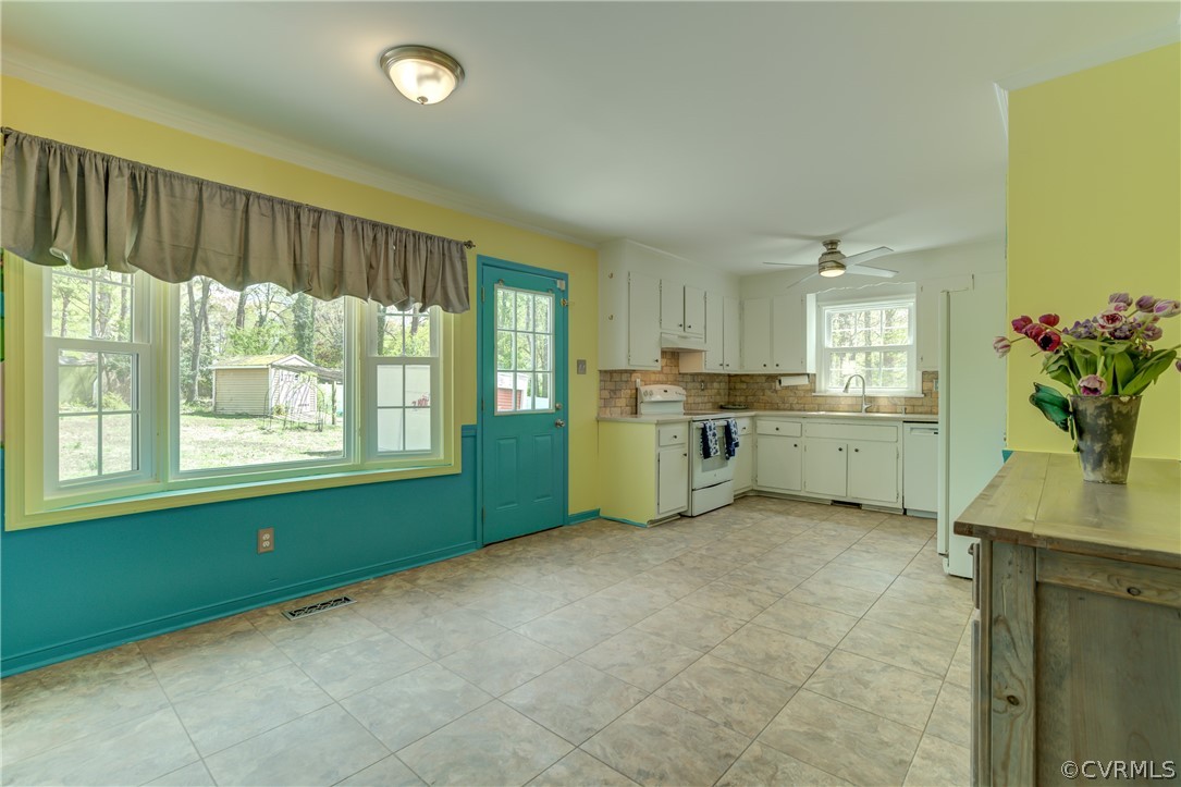 2863 Iverson Road Midlothian, VA 23112 - Photo 13 of 38 a view of an empty room with a window and kitchen view
