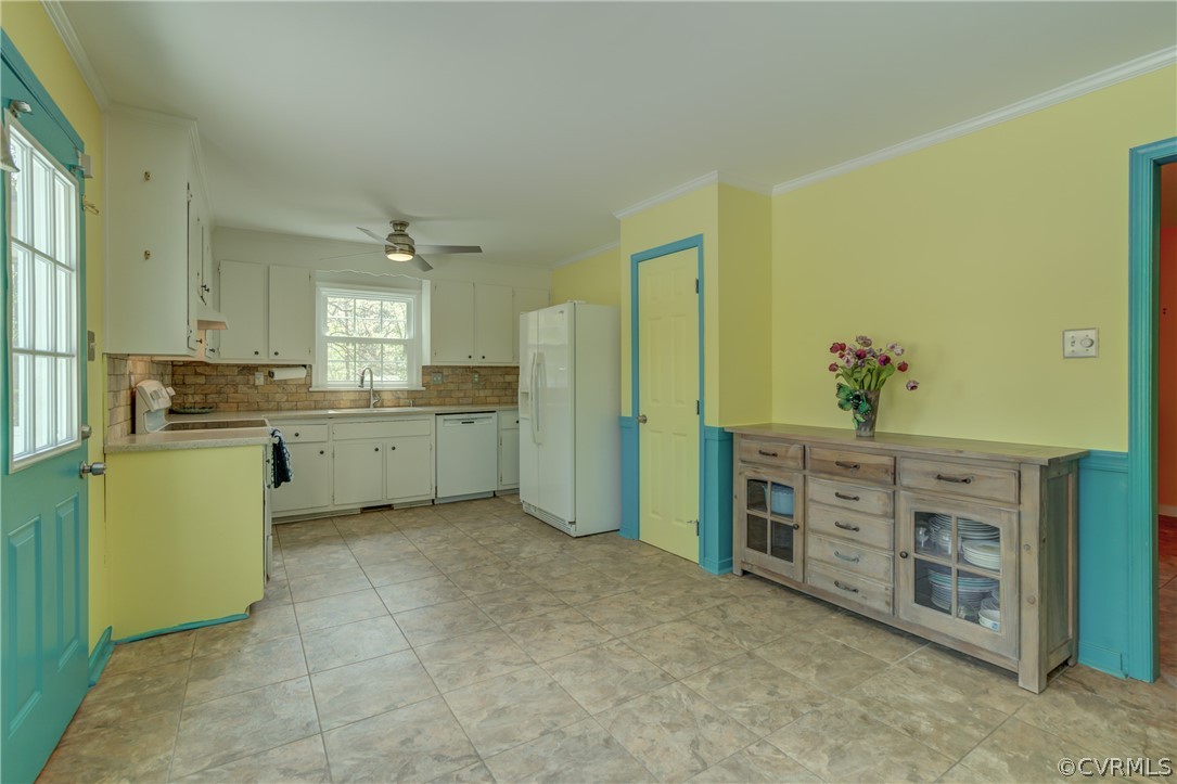 2863 Iverson Road Midlothian, VA 23112 - Photo 16 of 38 a view of a kitchen with sink cabinets and entryway