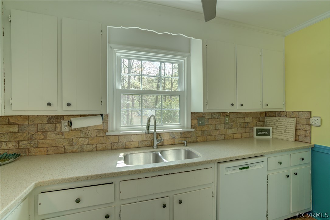 2863 Iverson Road Midlothian, VA 23112 - Photo 17 of 38 a kitchen with stainless steel appliances white cabinets and a sink