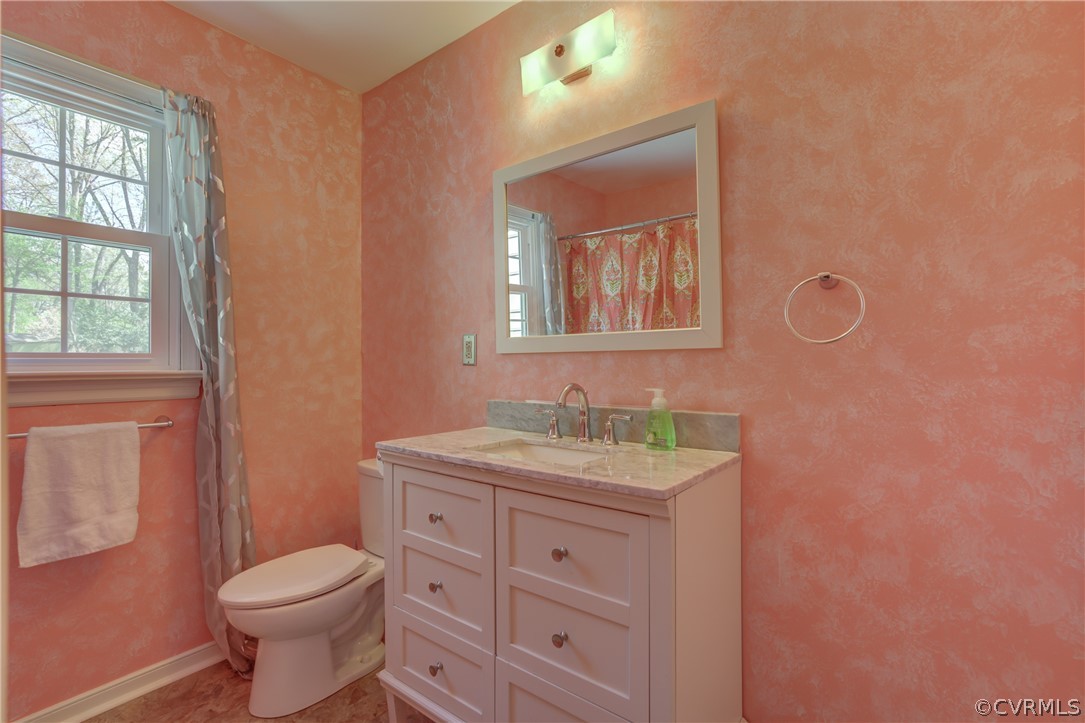 2863 Iverson Road Midlothian, VA 23112 - Photo 20 of 38 a bathroom with a granite countertop toilet sink and mirror