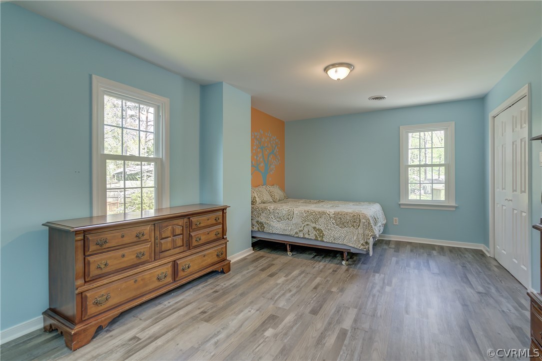 2863 Iverson Road Midlothian, VA 23112 - Photo 24 of 38 a bedroom with a dresser and a window