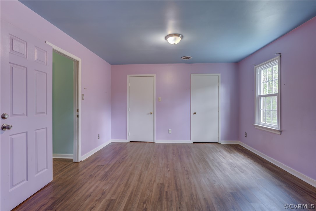 2863 Iverson Road Midlothian, VA 23112 - Photo 31 of 38 an empty room with wooden floor and windows