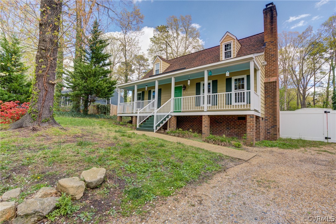 2863 Iverson Road Midlothian, VA 23112 - Photo 4 of 38 a view of a brick house with a yard and large trees