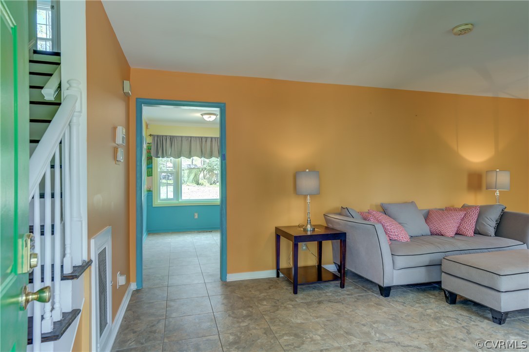 2863 Iverson Road Midlothian, VA 23112 - Photo 9 of 38 a living room with furniture and a floor to ceiling window
