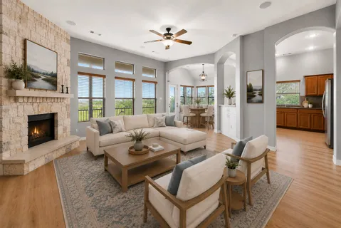 a living room with furniture and a fireplace