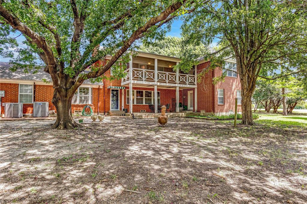 216 McMillen Road Lucas, TX 75002 - Photo 34 of 36 a front view of a house with a tree
