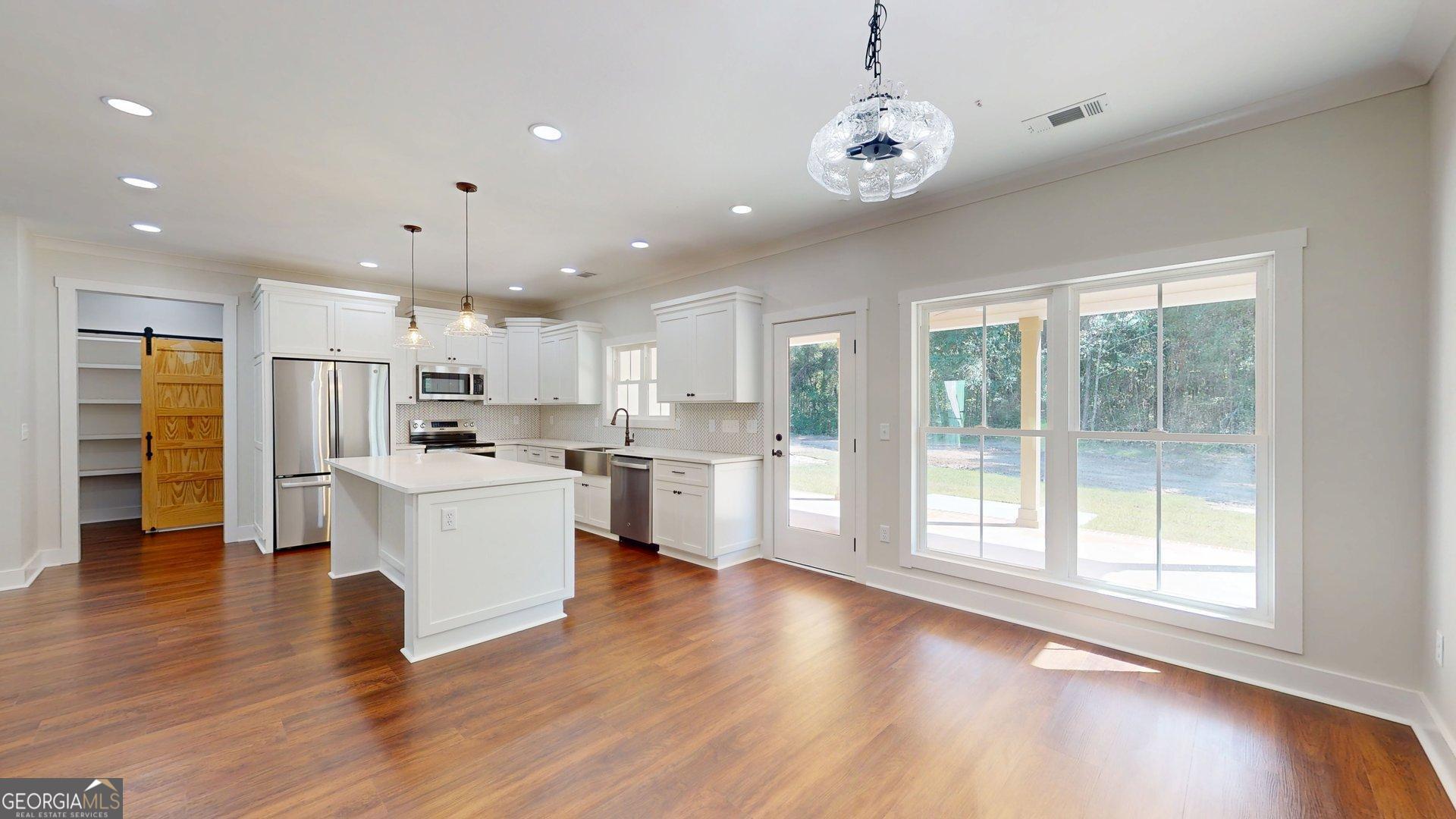 53 Jericho Lane Brooklet, GA 30415 - Photo 12 of 54 a view of kitchen with stainless steel appliances refrigerator oven microwave and cabinets