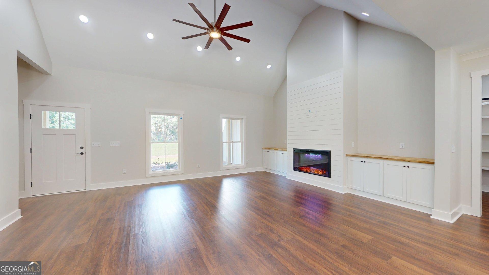 53 Jericho Lane Brooklet, GA 30415 - Photo 21 of 54 a view of an empty room with window and wooden floor