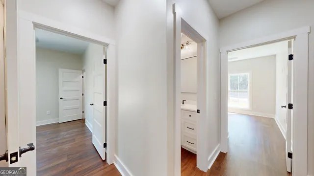 a view of a room with wooden floor
