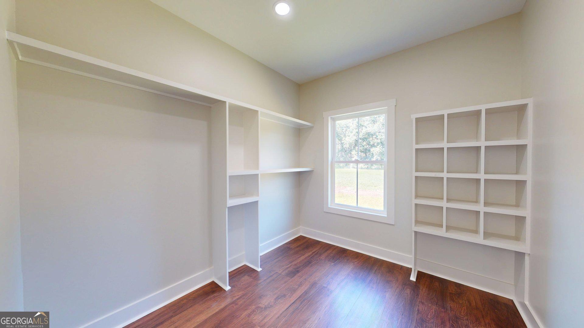 53 Jericho Lane Brooklet, GA 30415 - Photo 44 of 54 a view of an empty room with a window and wooden floor