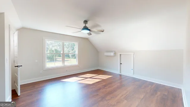 a bathroom with a sink a mirror and shower