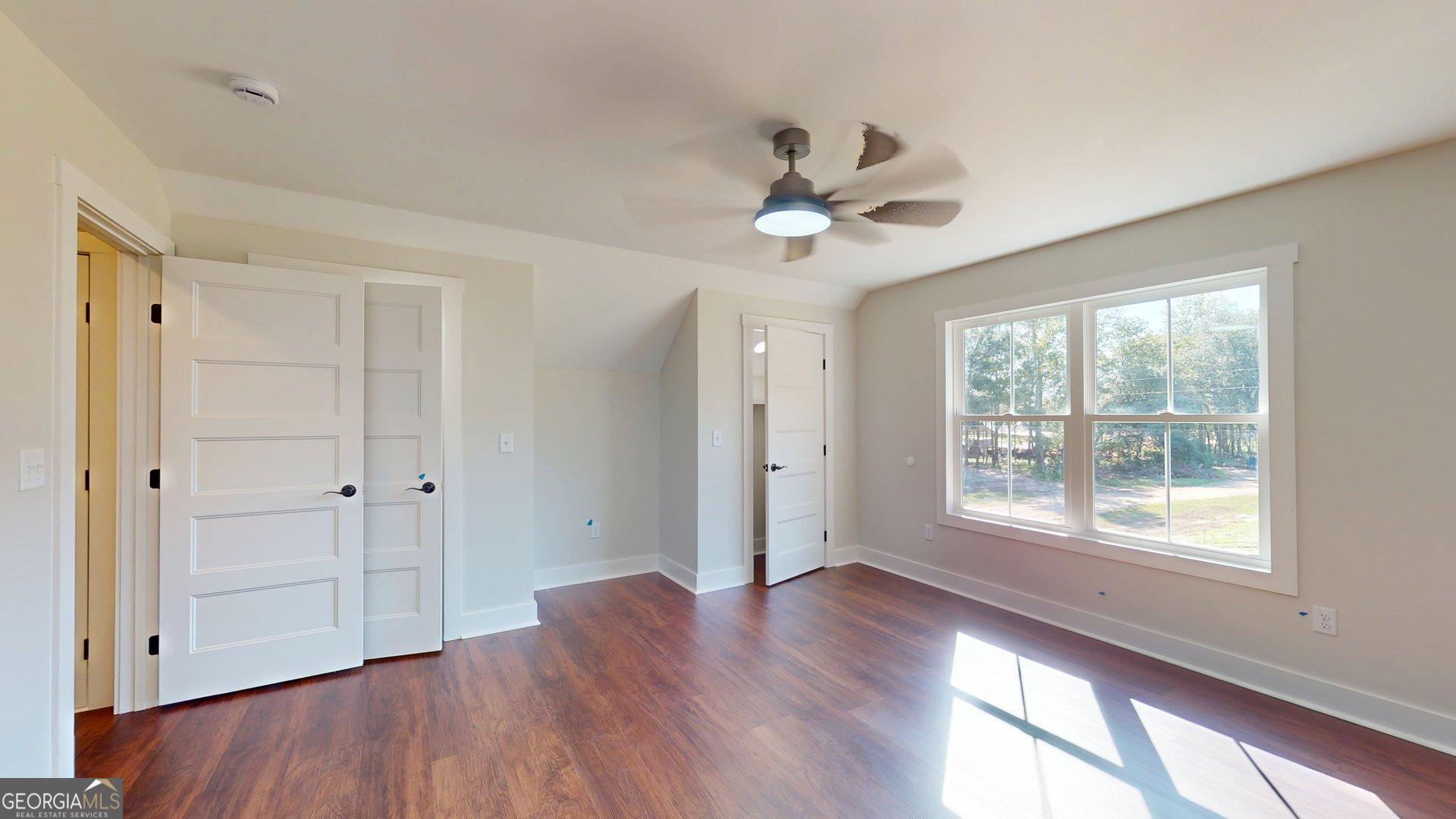 53 Jericho Lane Brooklet, GA 30415 - Photo 46 of 54 a view of an empty room with a window and wooden floor