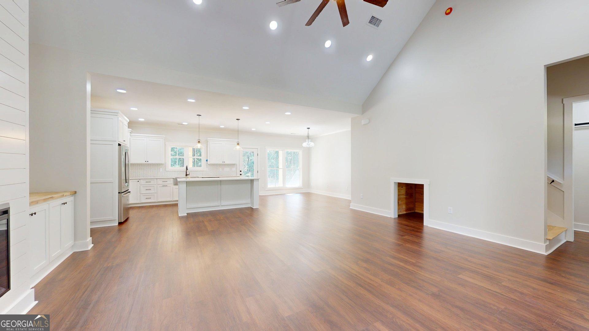 53 Jericho Lane Brooklet, GA 30415 - Photo 10 of 54 a view of an empty room with a window and wooden floor