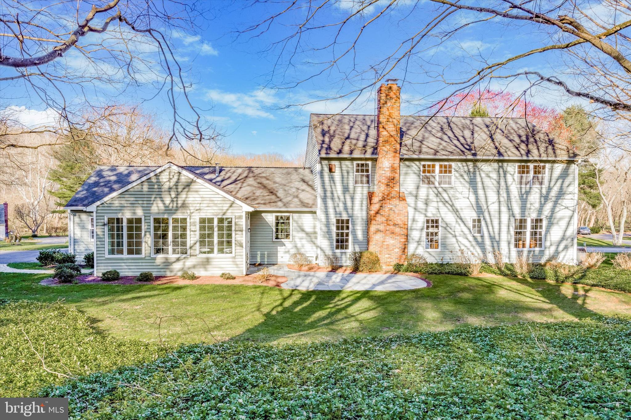 844 Hunt Road Newtown Square, PA 19073 - Photo 2 of 35 a front view of a house with a big yard
