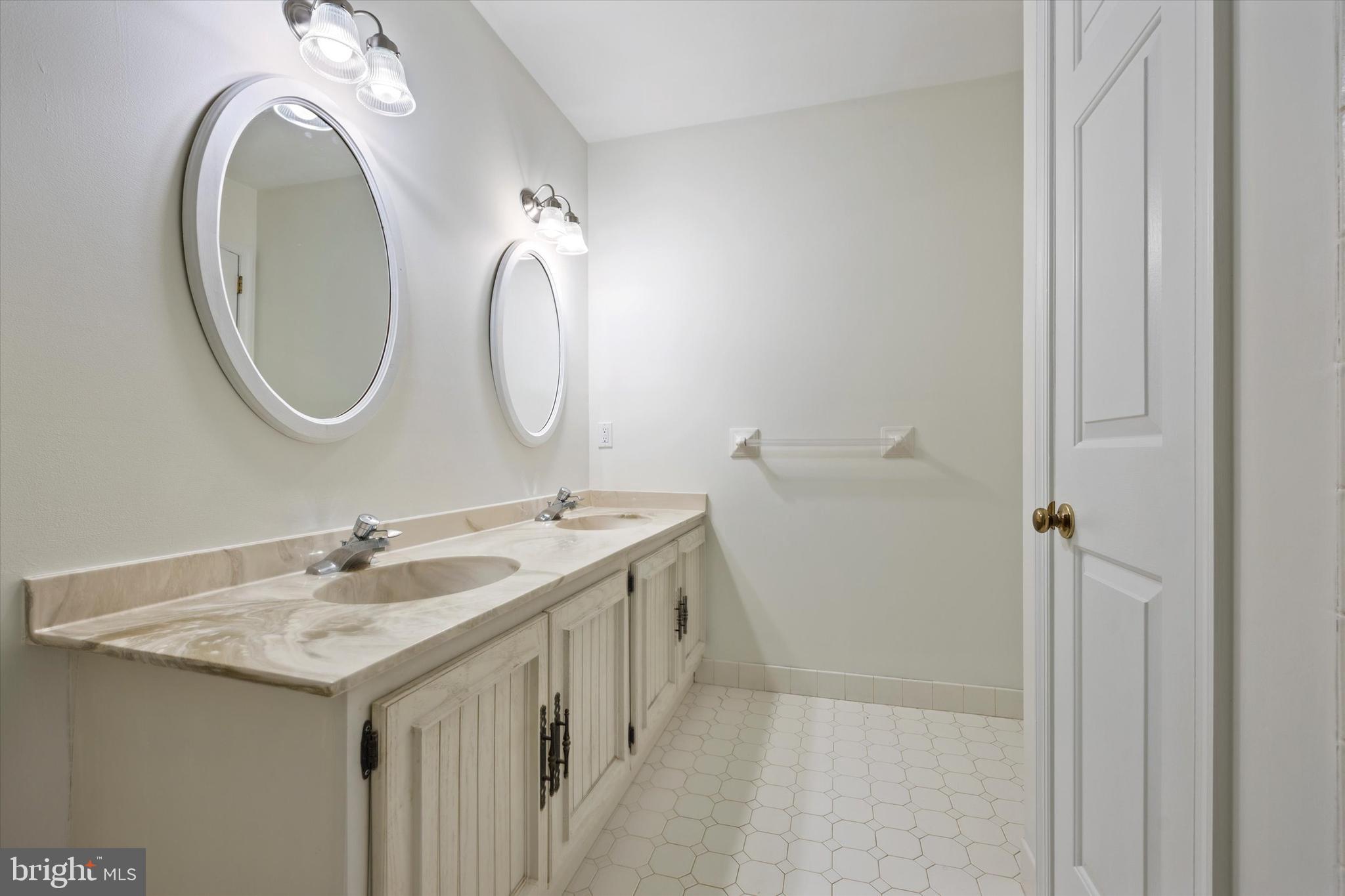 844 Hunt Road Newtown Square, PA 19073 - Photo 24 of 35 a bathroom with a sink and a mirror