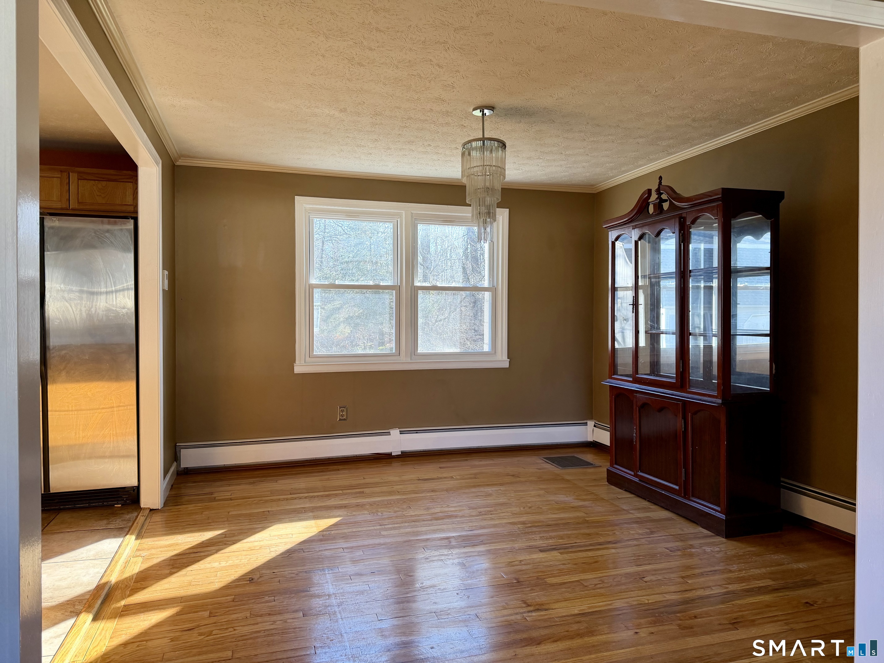 44 Crabapple Road Windsor, CT 06095 - Photo 11 of 38 a view of livingroom with hardwood floor and hallway