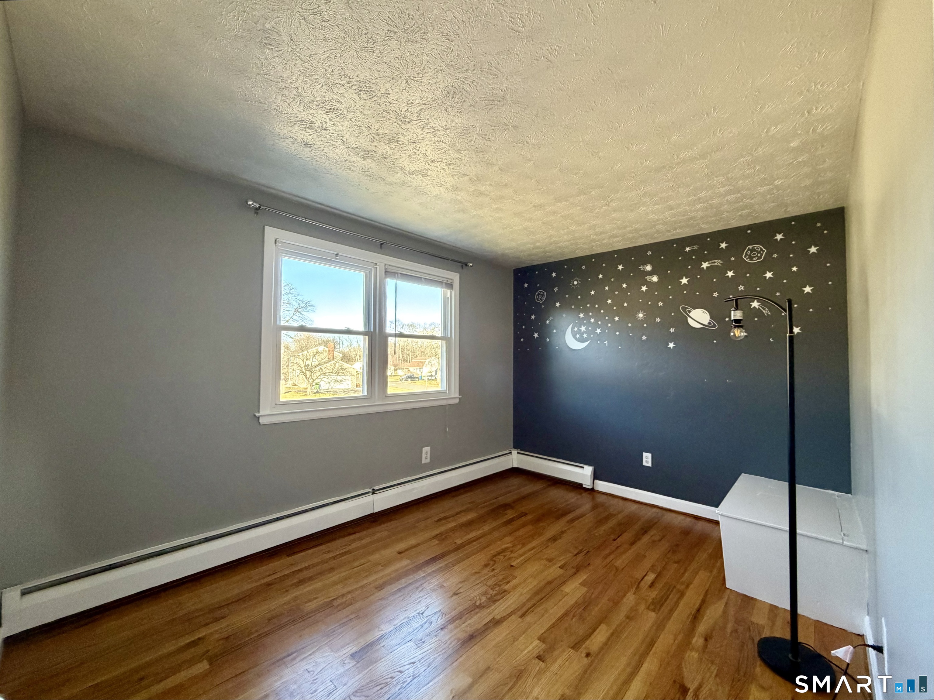44 Crabapple Road Windsor, CT 06095 - Photo 15 of 38 an empty room with wooden floor and windows