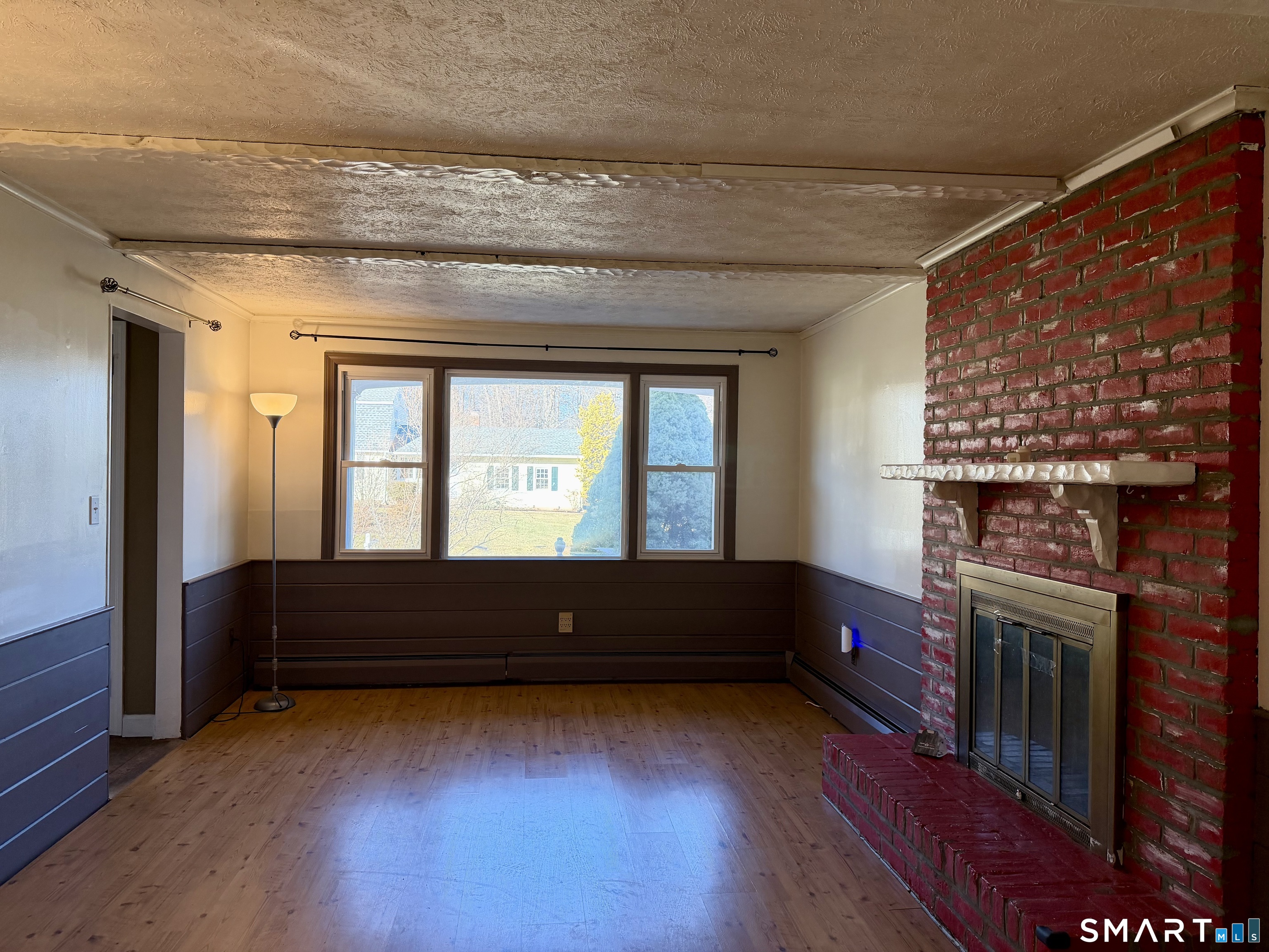 44 Crabapple Road Windsor, CT 06095 - Photo 18 of 38 a living room with a fireplace