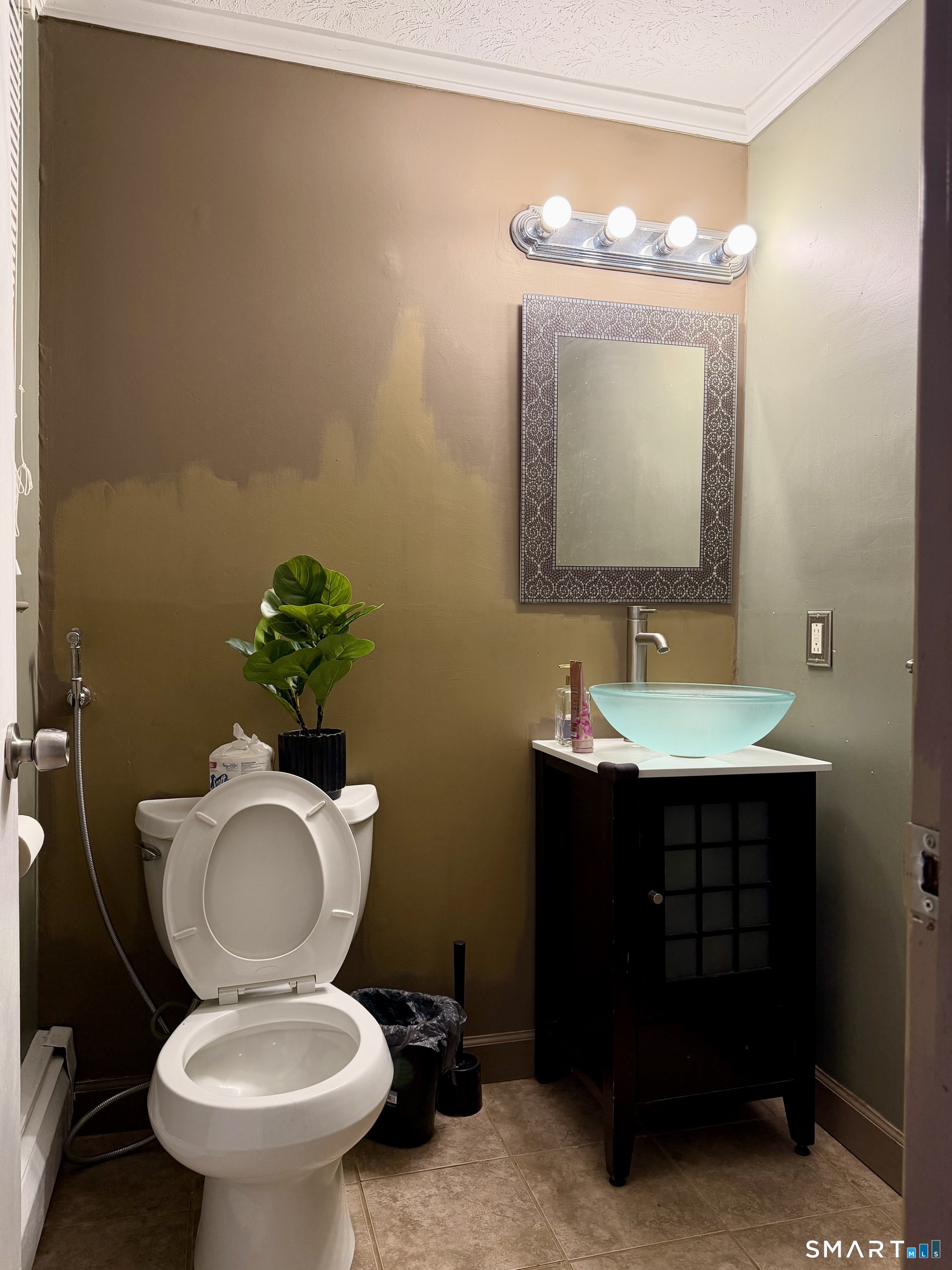 44 Crabapple Road Windsor, CT 06095 - Photo 21 of 38 a bathroom with a toilet sink vanity and mirror