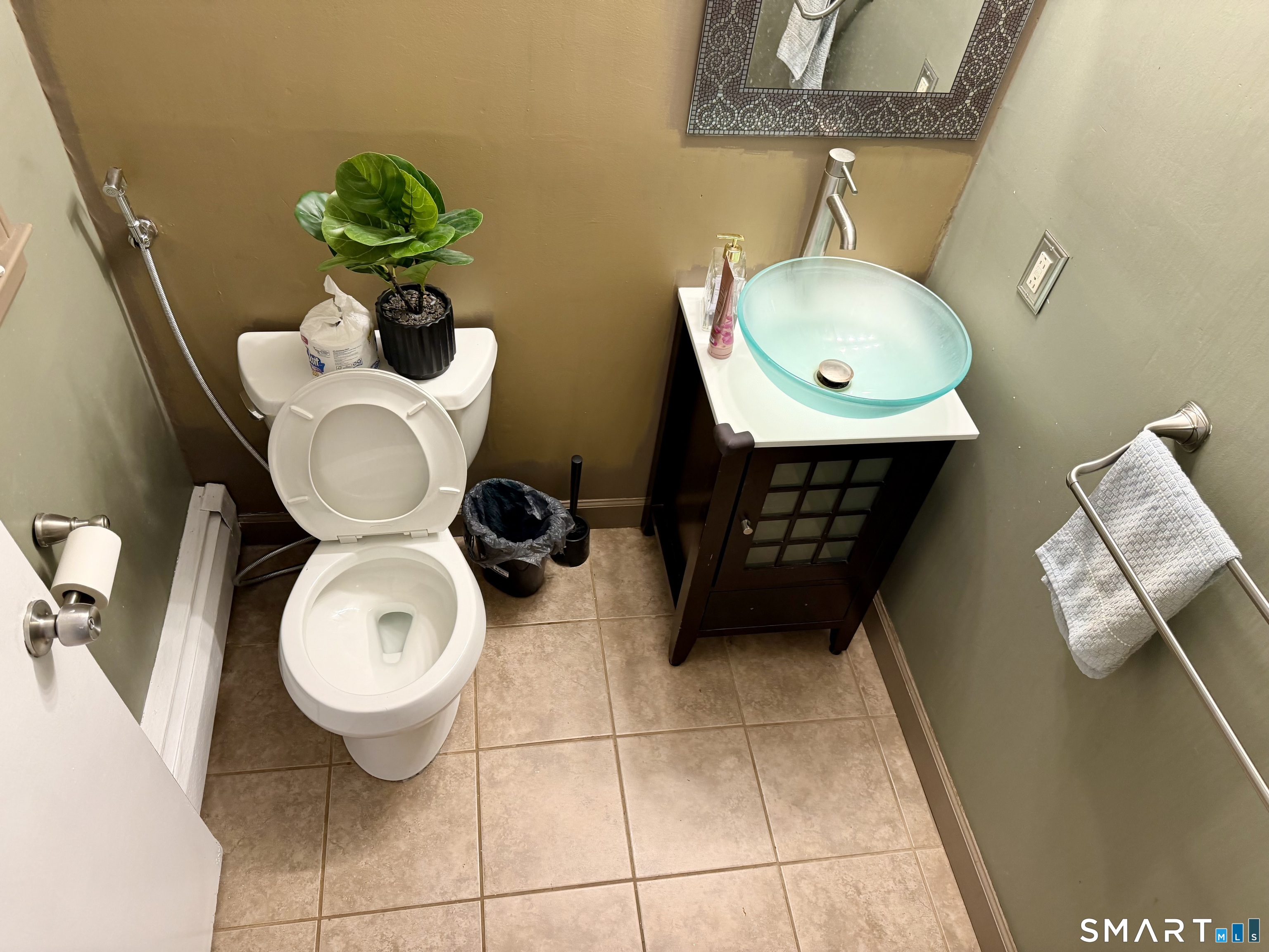 44 Crabapple Road Windsor, CT 06095 - Photo 22 of 38 a bathroom with a toilet mirror and sink