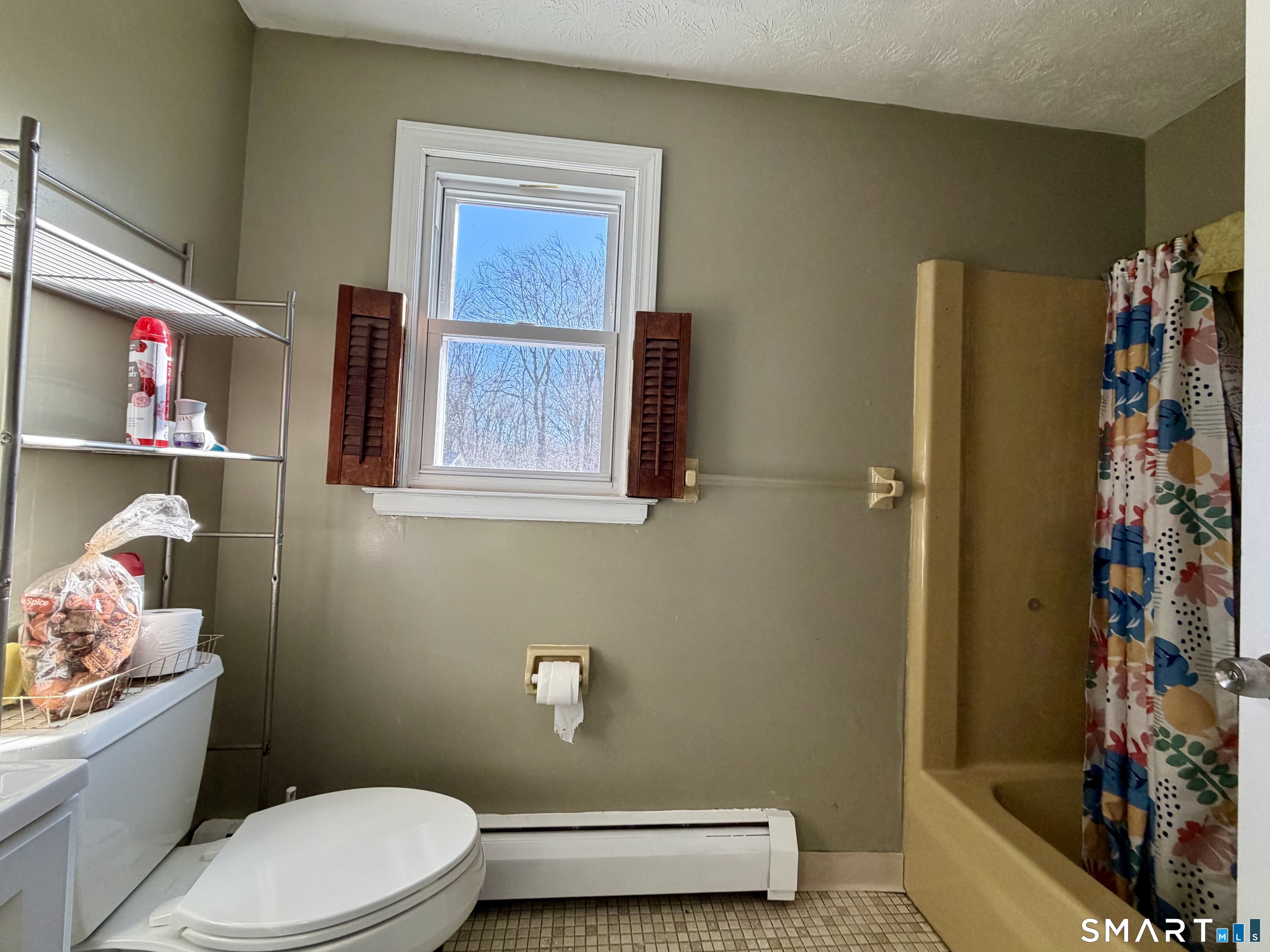 44 Crabapple Road Windsor, CT 06095 - Photo 28 of 38 a bathroom with a sink a toilet and shower curtain