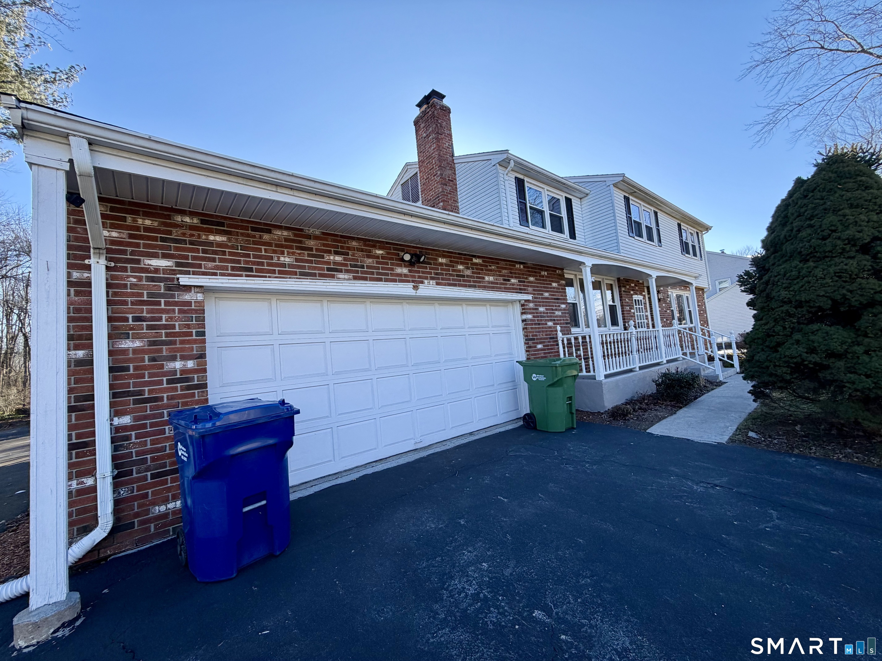 44 Crabapple Road Windsor, CT 06095 - Photo 3 of 38 a view of backyard with a table and chair with wooden fence