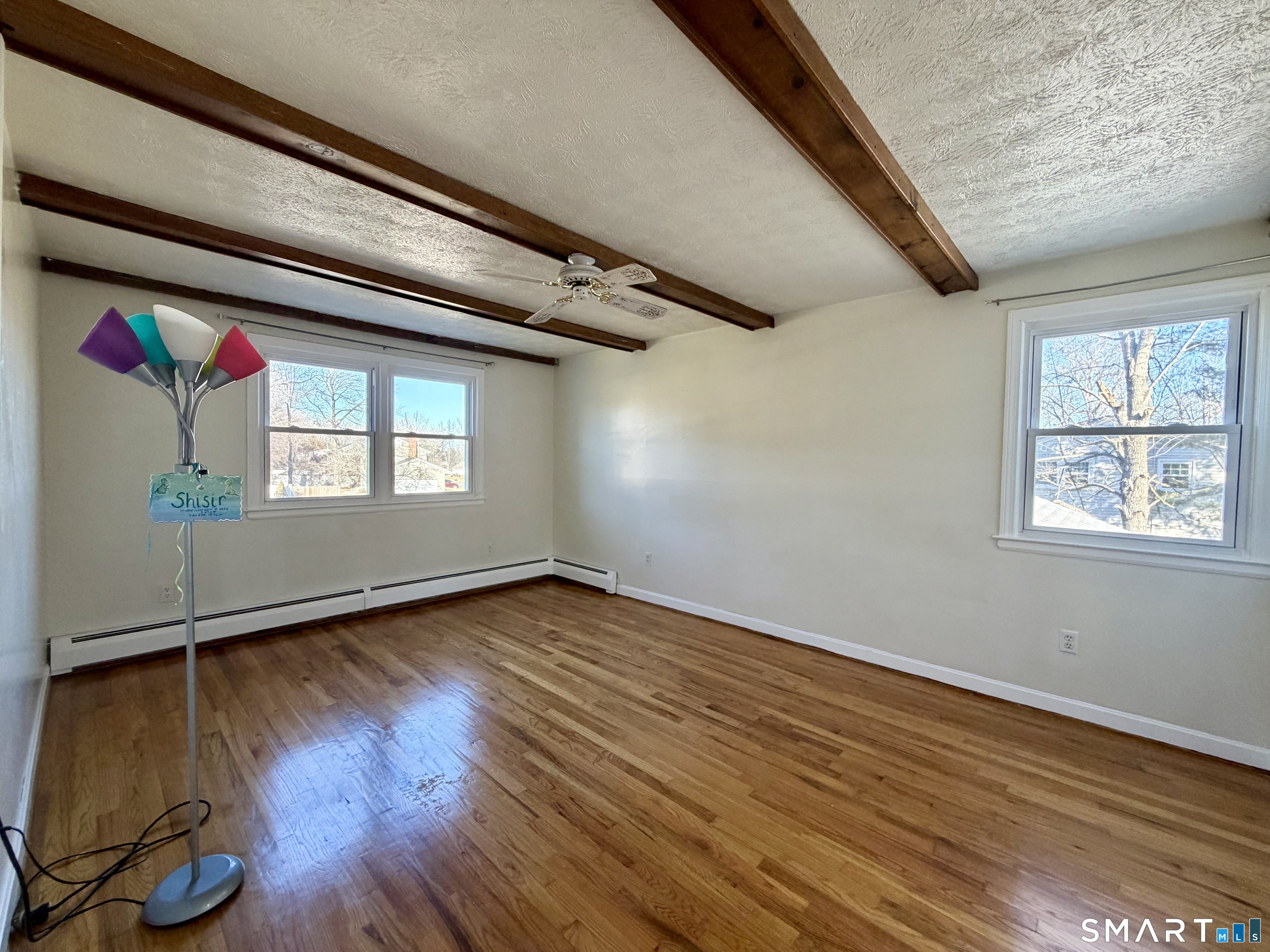44 Crabapple Road Windsor, CT 06095 - Photo 31 of 38 a view of an empty room with wooden floor and a window