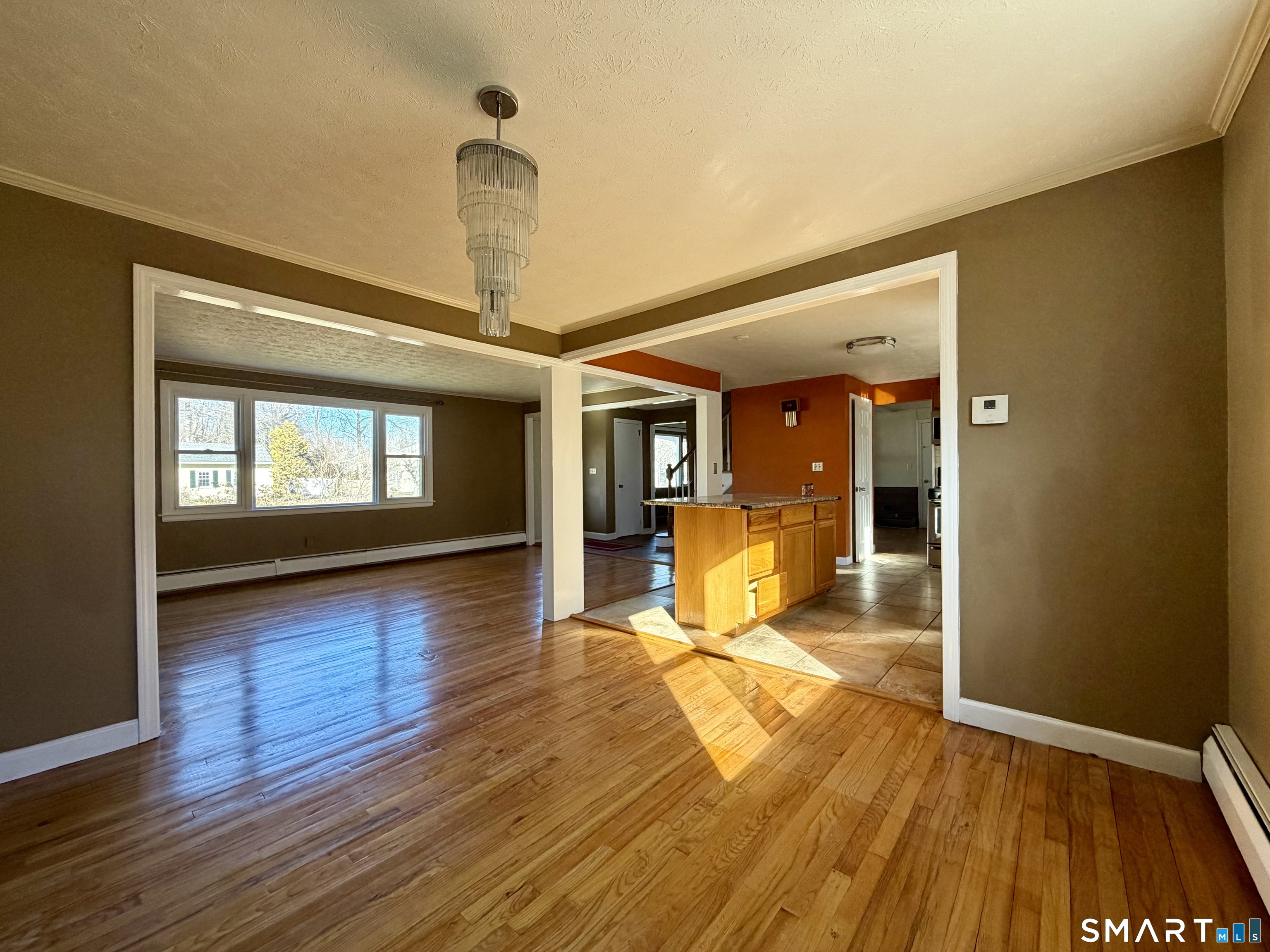 44 Crabapple Road Windsor, CT 06095 - Photo 7 of 38 a view of livingroom with wooden floor and window