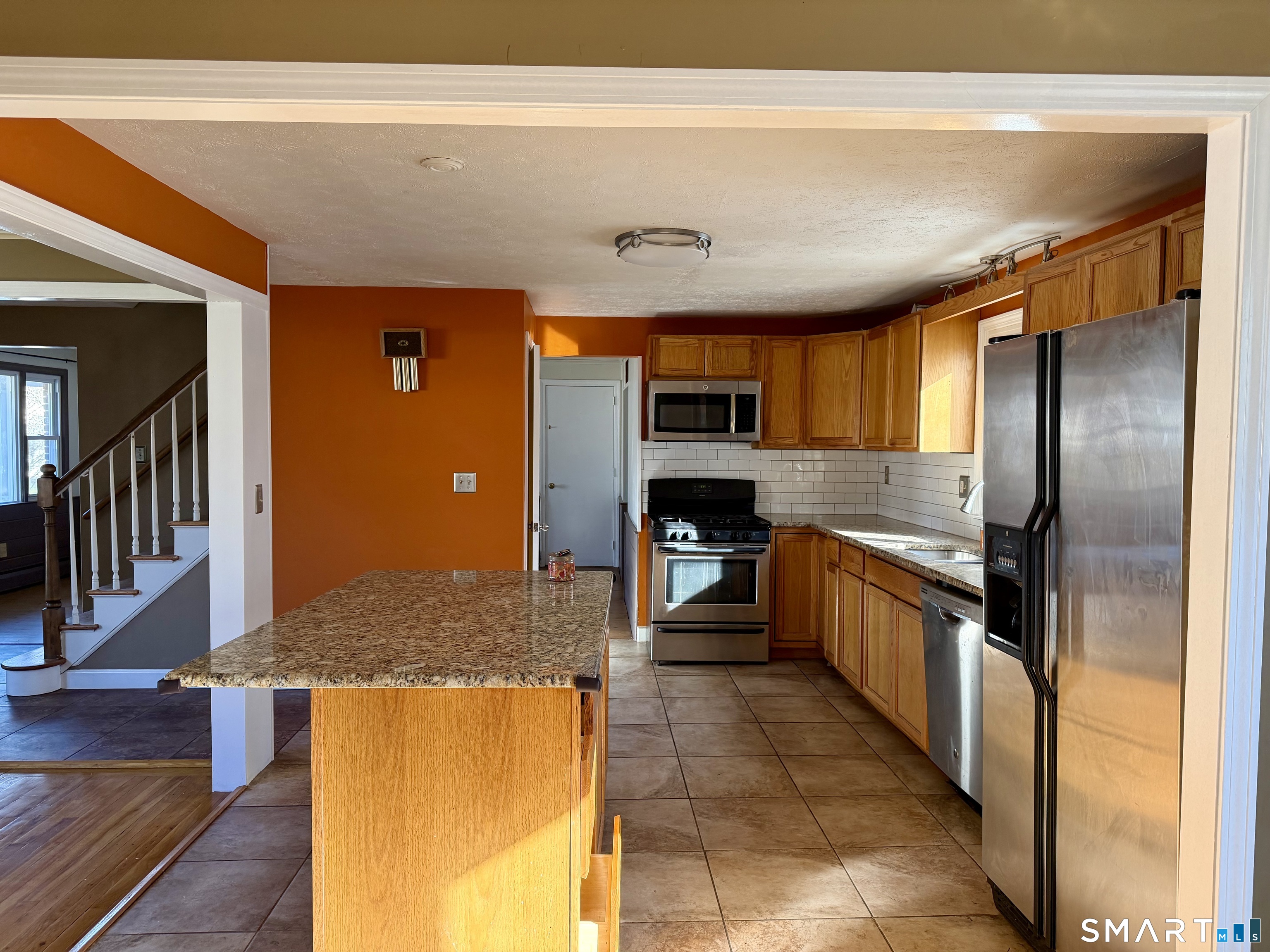 44 Crabapple Road Windsor, CT 06095 - Photo 9 of 38 a kitchen with stainless steel appliances granite countertop a refrigerator and a stove