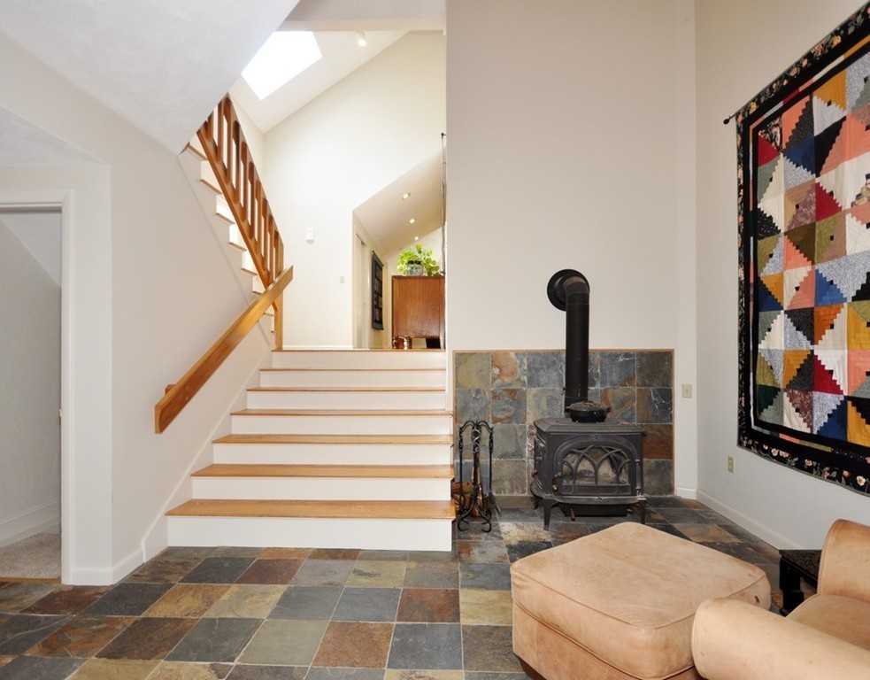 163 Sunset Road Carlisle, MA 01741 - Photo 11 of 19 a living room with furniture and a painting on the wall