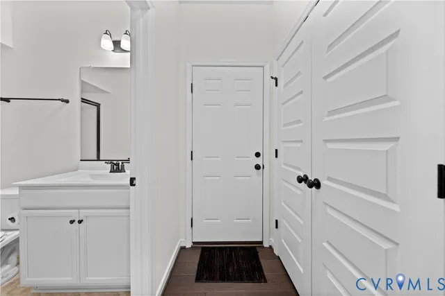 an empty room with window and a ceiling fan