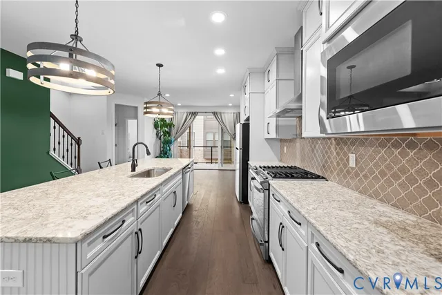 a bathroom with a sink a toilet and bathtub