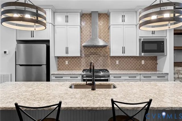 a view of a kitchen with a sink cabinets and a window