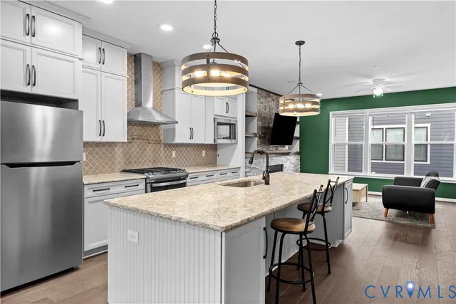 a bathroom with a sink toilet vanity and tub
