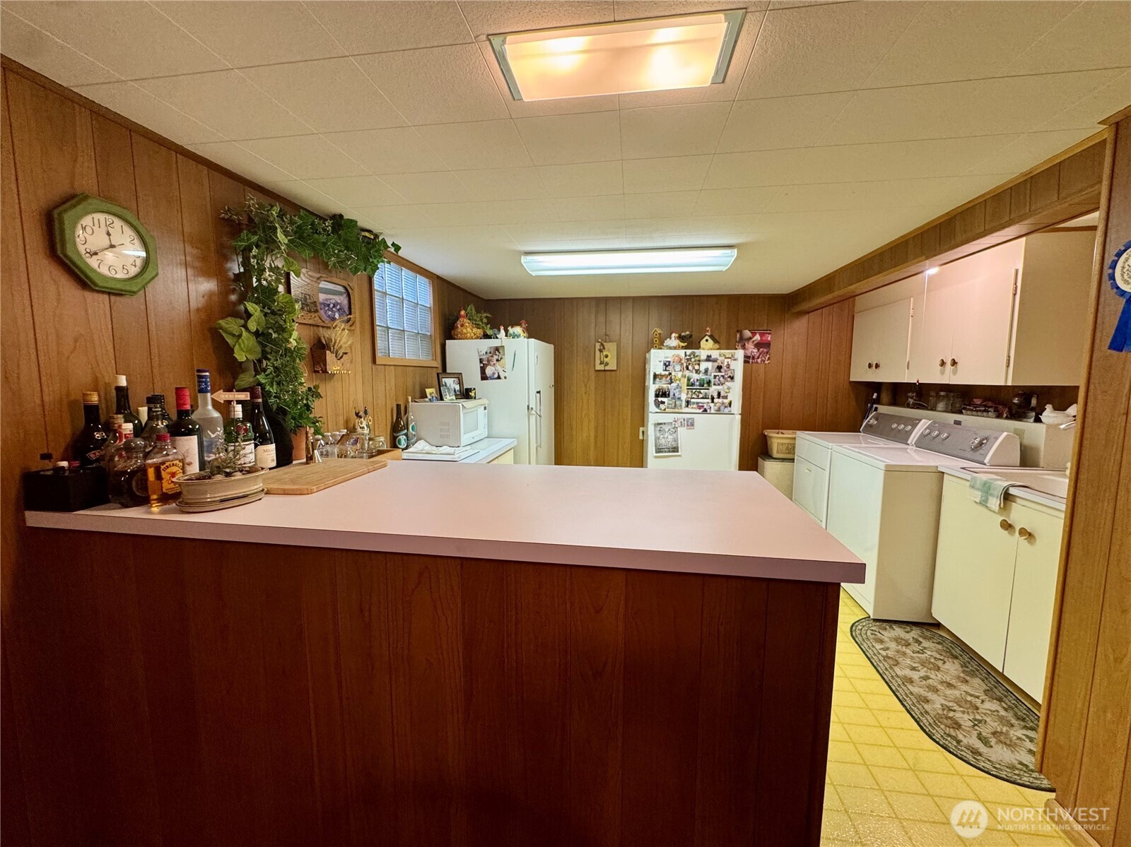 309 West 9th Avenue Ritzville, WA 99169 - Photo 22 of 31 a room with kitchen island a sink a stove and cabinets
