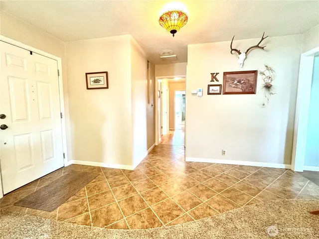 a view of a hallway with a bathroom