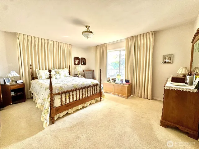 a bedroom with a bed and a couch