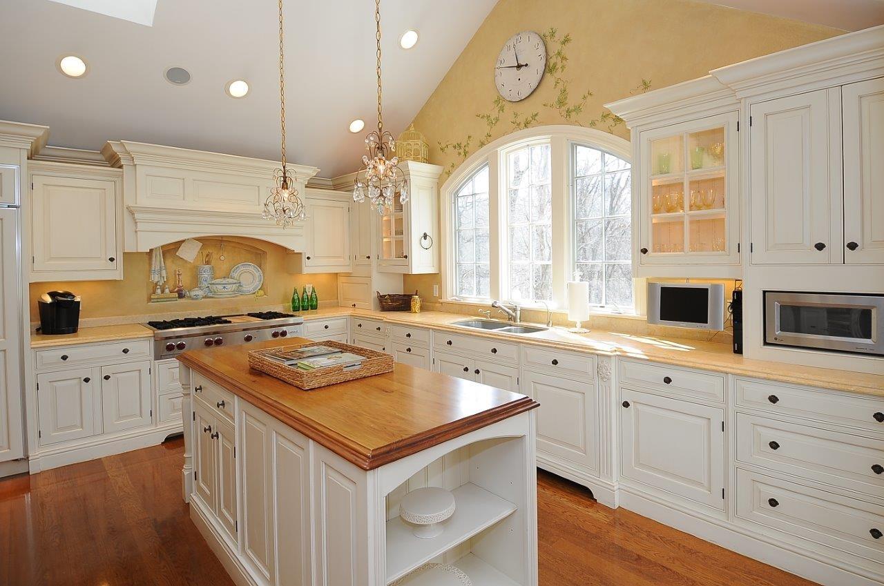 227 Marvin Ridge Road New Canaan, CT 06840 - Photo 12 of 34 a kitchen with a stove a sink and a refrigerator