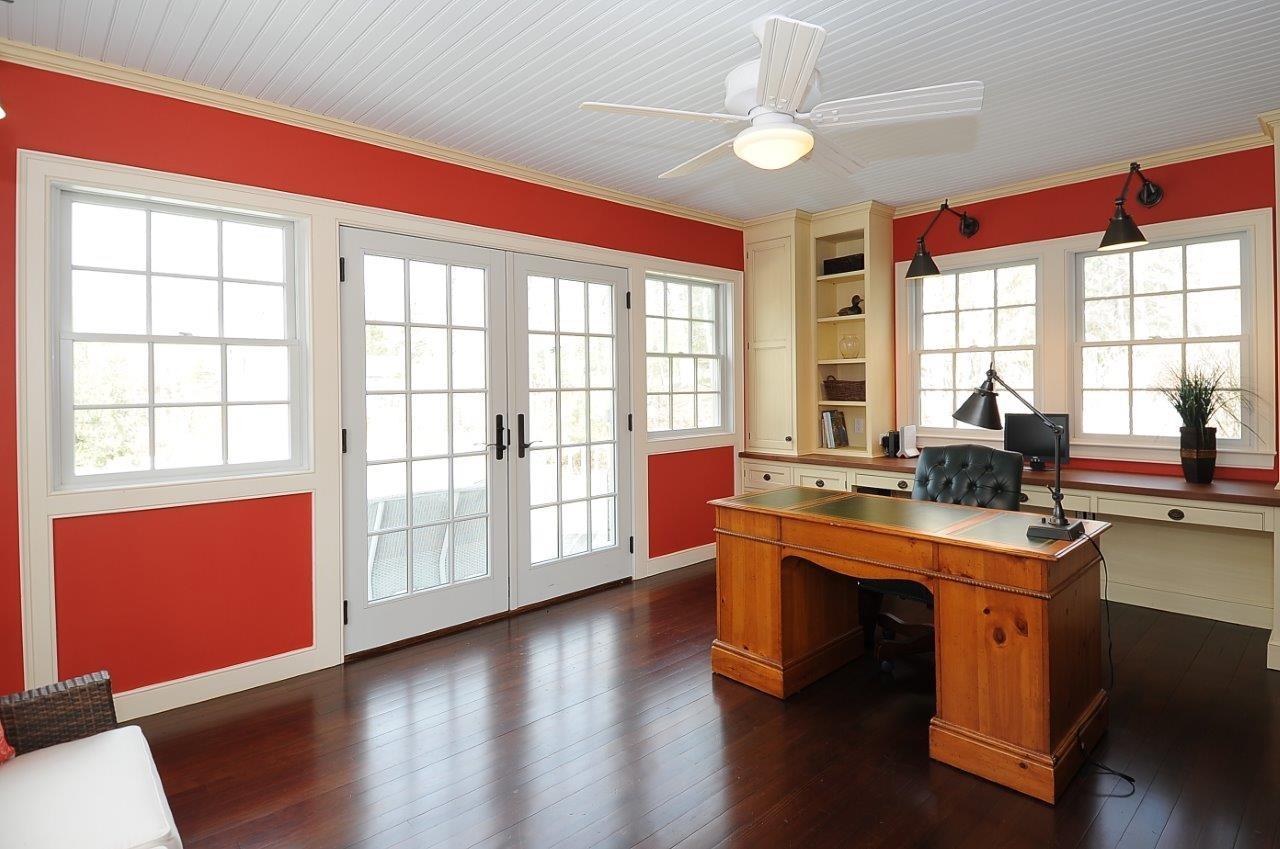 227 Marvin Ridge Road New Canaan, CT 06840 - Photo 16 of 34 a view of a room with wooden floor and chandelier