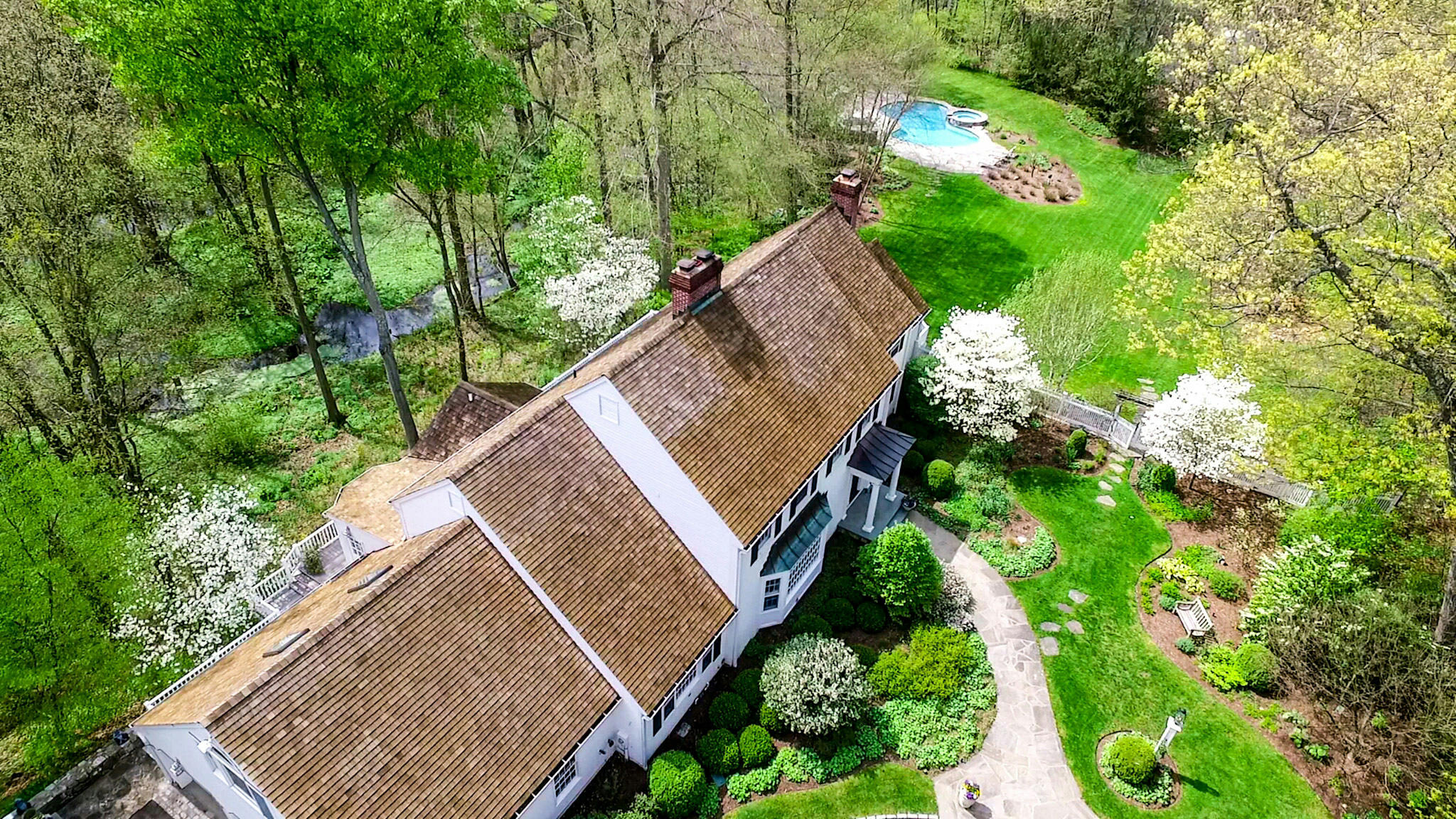 227 Marvin Ridge Road New Canaan, CT 06840 - Photo 31 of 34 a view of house with a small yard