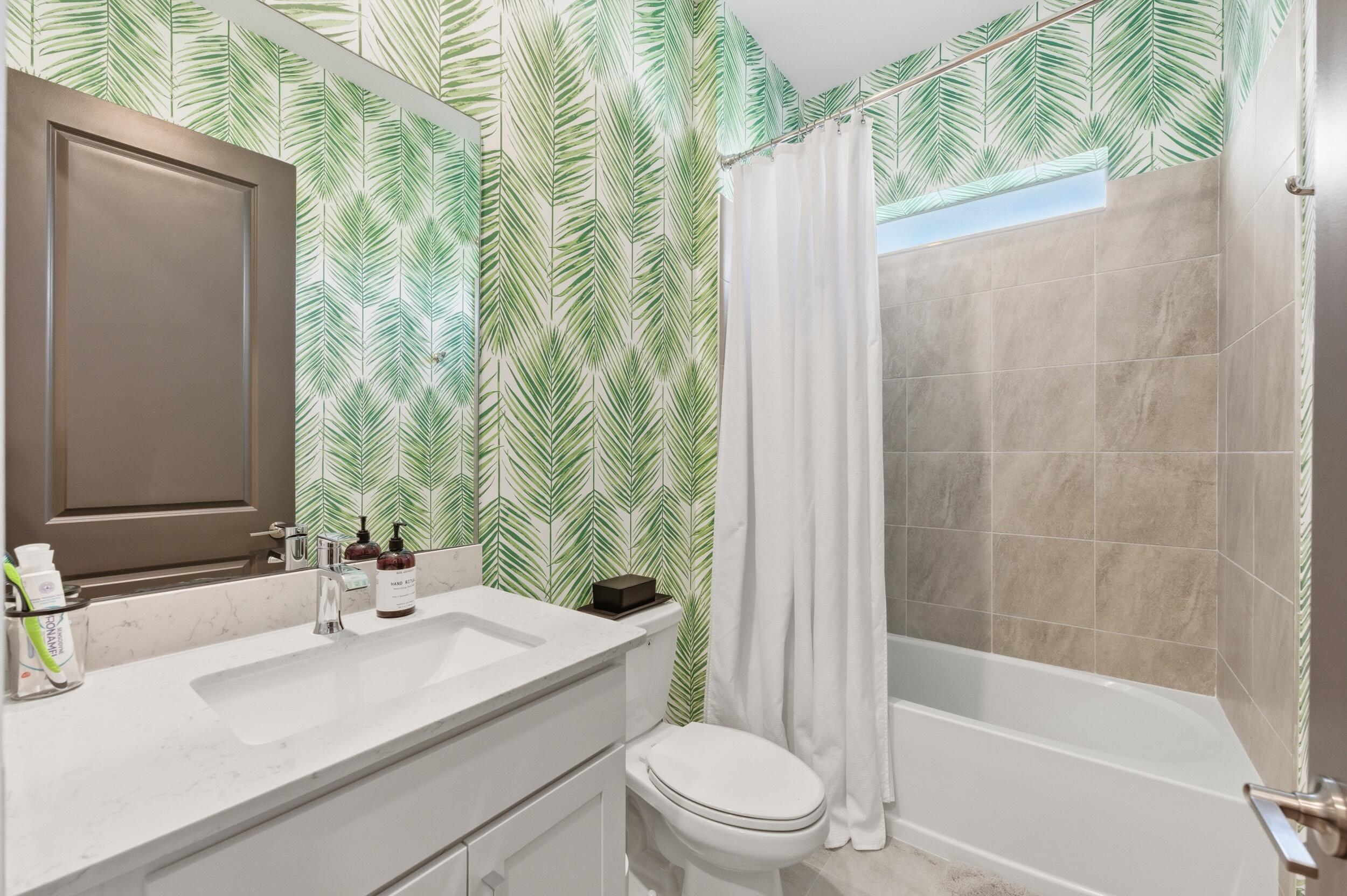 19230 Rolling Acres Road Loxahatchee, FL 33470 - Photo 16 of 58 a bathroom with a sink a toilet and shower