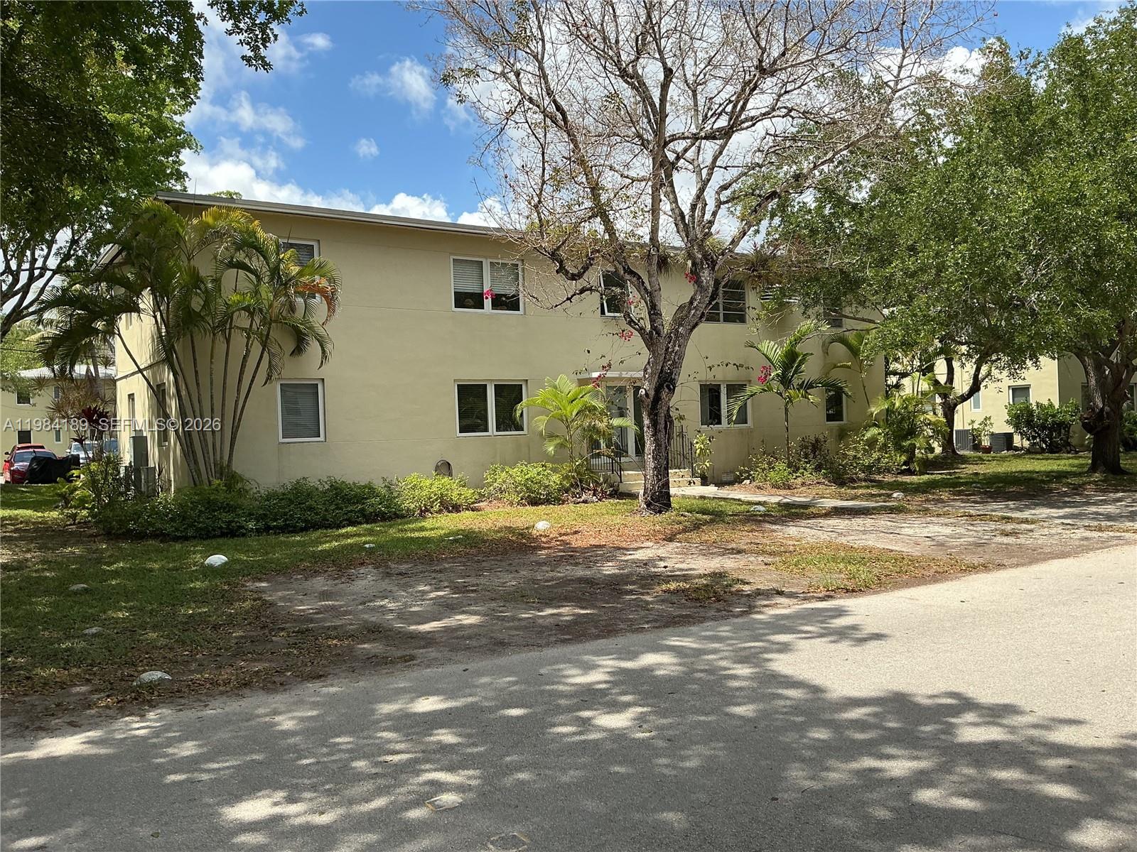 7734 Southwest 55th Avenue, Unit C Miami, FL 33143 - Photo 2 of 6 a view of a house with a yard