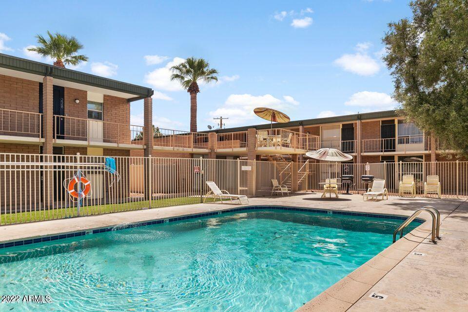 3737 East Turney Avenue, Unit 116 Phoenix, AZ 85018 - Photo 21 of 24 a view of a house with backyard porch and sitting area