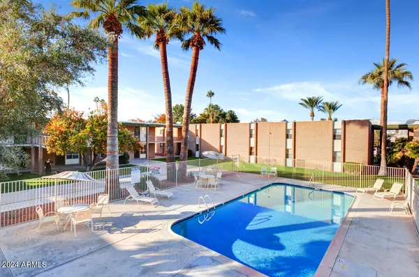 a view of a swimming pool with a patio