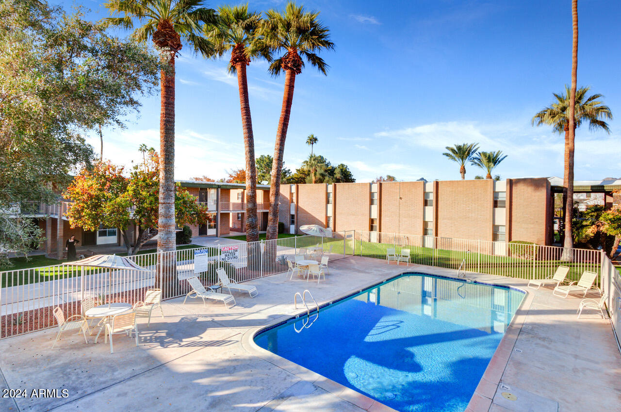 3737 East Turney Avenue, Unit 116 Phoenix, AZ 85018 - Photo 22 of 24 a view of a swimming pool with a patio