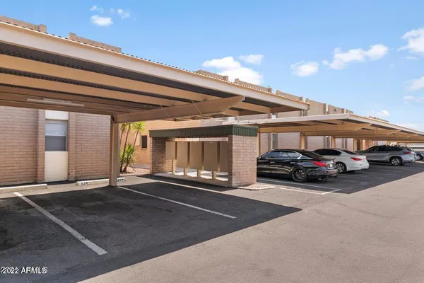 a view of a car park in front of house