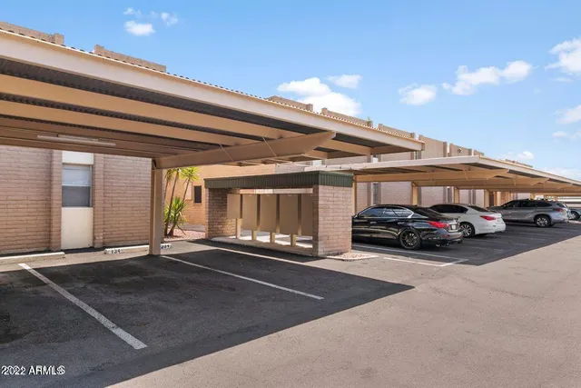 a view of a car park in front of house