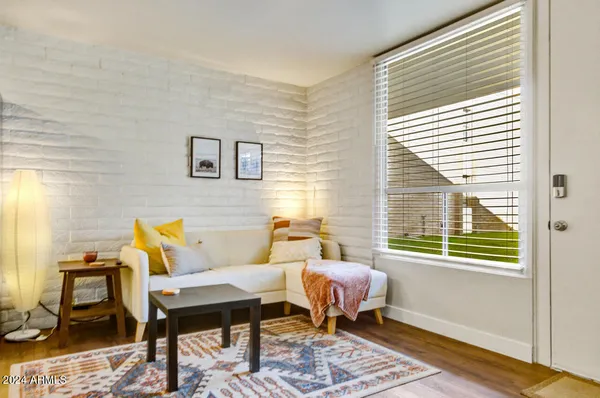 a living room with furniture and a window