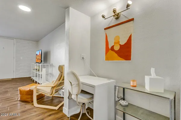 a view of a livingroom with furniture and wooden floor
