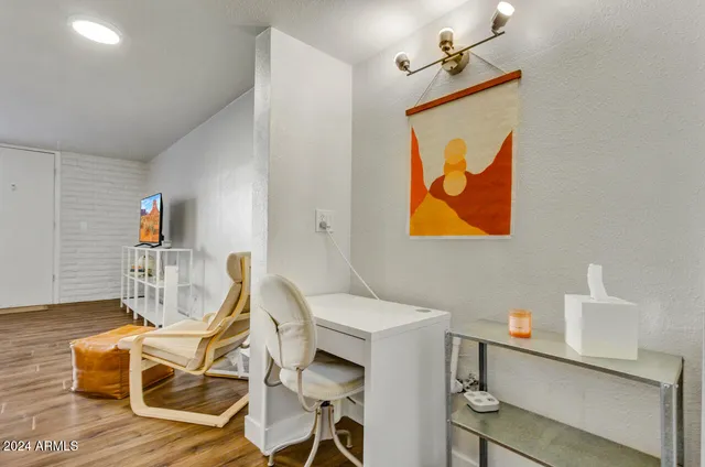 a view of a livingroom with furniture and wooden floor